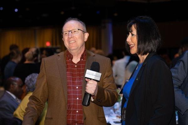 President Philomena V. Mantella speaks with the media prior to the 50 Most Influential Women event.